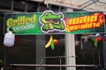 The colorful sign of a mobile crocodile grill