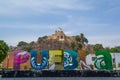 Colorful Sign for Puebla in front of the Giant Pyramid of Cholula