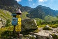 Colorful signpost set against a backdrop of rugged mountains. Western Tatras, Slovakia. Royalty Free Stock Photo