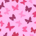 Colorful silhouettes of butterflies and white dots on a light pink background. Insects. Seamless summer pattern. Royalty Free Stock Photo