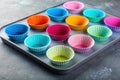Colorful silicone baking cups arranged on a baking tray ready for use. Generative AI Royalty Free Stock Photo
