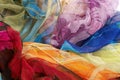 Colorful silk scarves on white background