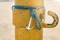 Colorful silver anchor wristband with blue rope Royalty Free Stock Photo