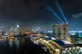 Colorful Singapore skyscraper building and laser show in night a Royalty Free Stock Photo