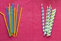 Colorful single use disposable plastic straws vs paper straws Royalty Free Stock Photo