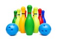 Colorful skittles and two balls isolated on white background. Group of bowling pins and balls isolated on white background Royalty Free Stock Photo