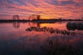 Colorful sky and clouds after sunset over a frozen lake Royalty Free Stock Photo