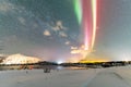 Colorful sky illuminated by spectacular purple and green lights.