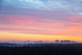 Colorful sky over city and park at cold dawn Royalty Free Stock Photo