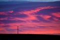 Colorful sky at sunrise with silhouetted power line