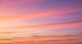 Colorful sky during sunset with soft parallel streaks of clouds Royalty Free Stock Photo