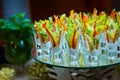 Colorful slices of raw vegetables in glasses