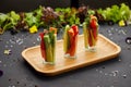 Colorful slices of raw vegetables in glasses carrots, cucumber, sweet pepper. The concept of diet, healthy and vegetarian food