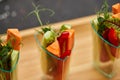 Colorful slices of raw vegetables in glasses carrots, cucumber, sweet pepper. The concept of diet, healthy and vegetarian food