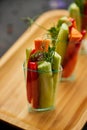 Colorful slices of raw vegetables in glasses carrots, cucumber, sweet pepper. The concept of diet, healthy and vegetarian food