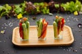 Colorful slices of raw vegetables in glasses carrots, cucumber, sweet pepper. The concept of diet, healthy and vegetarian food