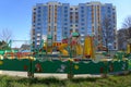 Colorful slides and swings in the playground. Empty children`s playground near an apartment building Royalty Free Stock Photo