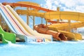 Colorful slides in water park on sunny day