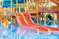 Colorful slides in the waterpark close up. Aquapark sliders with pool