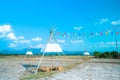 Colorful small flags in the sky. Waving small colorful flags hanging on the rope for holidays against blue sky Royalty Free Stock Photo