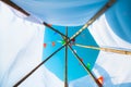 Colorful small flags in the sky. Waving small colorful flags hanging on the rope for holidays against blue sky Royalty Free Stock Photo