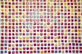 Colorful small mosaic tiles on the wall with white fugue Royalty Free Stock Photo