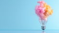 Colorful smoke exploding from a light bulb creating a vibrant and dynamic visual on a blue background Royalty Free Stock Photo
