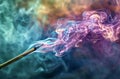 Colorful smoke rising from a smoldering matchstick