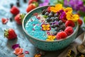 A colorful smoothie bowl with artistic fruit arrangements.
