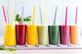 colorful smoothie collection in tall glasses with straws Royalty Free Stock Photo