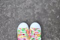 Colorful Sneakers on Asphalt Road Royalty Free Stock Photo