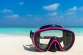 Colorful snorkel mask by the sea, remote tropical beaches. Travel and vacation concept