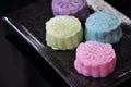 Colorful Snow Skin Mooncake on Black Plate