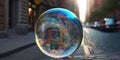 A colorful soap bubble rolling in the street of a city. Focus on the bubble, buildings around. The environment is slightly blurred