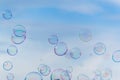 Colorful soap bubbles against blue sky background Royalty Free Stock Photo