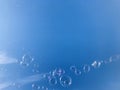 Colorful soap bubbles against blue sky background. Royalty Free Stock Photo