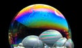 Colorful soap bubbles on a black background Royalty Free Stock Photo