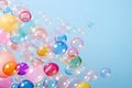 Colorful soap bubbles realistically foaming on a blue background with copy space