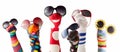 Sock puppets with glasses against white background Royalty Free Stock Photo