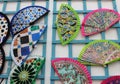 Colorful Spanish handmade fans attached to a blue wooden construction Royalty Free Stock Photo
