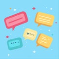 Colorful speech bubbles on light blue background with stars and dots Royalty Free Stock Photo