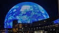 The colorful Sphere at The Venetian Resort surrounded by buildings at night in Las Vegas Nevada