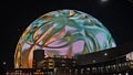 The colorful Sphere at The Venetian Resort surrounded by buildings at night in Las Vegas Nevada