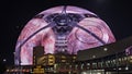 The colorful Sphere at The Venetian Resort surrounded by buildings at night in Las Vegas Nevada