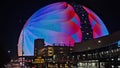 The colorful Sphere at The Venetian Resort surrounded by buildings at night in Las Vegas Nevada