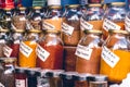 Colorful spice jars: A vivid palette of aromatic treasures, ready to infuse dishes with a burst of flavor and transport taste buds