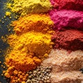 Colorful spices creating a vibrant and aromatic display on a dark surface Royalty Free Stock Photo