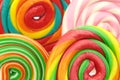 Colorful spiral lollipops , macro image as background.