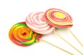 Colorful spiral lollipops on white background