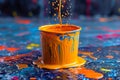 Colorful splash of oil paint from a bucket , splash of rainbow color paint Royalty Free Stock Photo